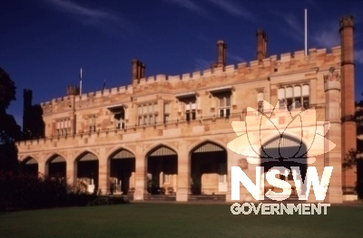 Government House is a Gothic Revival two storey building with crenellated battlements, turrets, detailed interiors, extensive cellars and a porte cochere at the entrance.