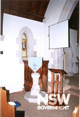 Interior view of church showing pulpit and sandstone font