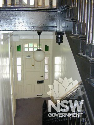 Interior view of Millers Point Post Office building looking west from the stair landing, showing original front door, sidelights and fanlight detailing facing Kent Street.