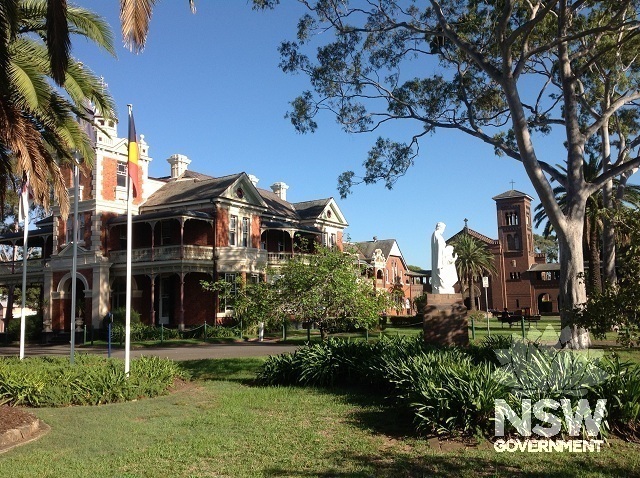Photograph of the main courtyard of the ACU Strathfield Campus with the Edmund Rice Building (incorporating the original Mount Royal villa mansion, built 1887) on the left and the Barron Chapel, built 1925, in the distance.