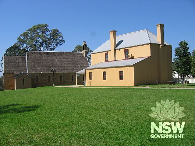 Former Macquarie Schoolhouse/Chapel (showing rear skillion) and St John's Anglican (Blacket) Church, taken from the north-east.