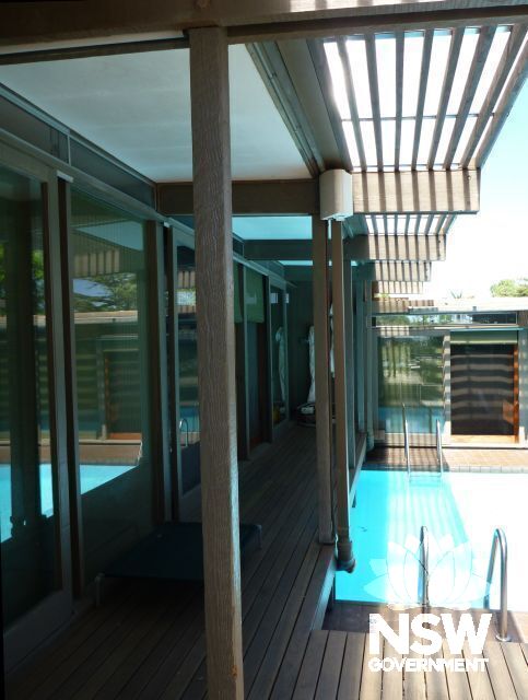 View of pool area showing play of light on deck.