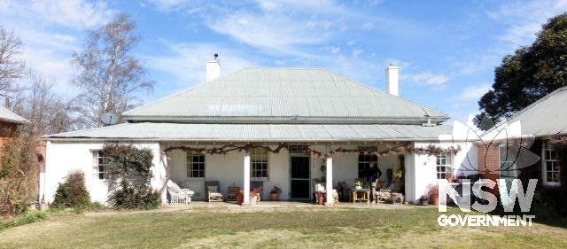 North façade of Grange farmhouse facing courtyard with cottage on left (east) and kitchen wing on right (west).