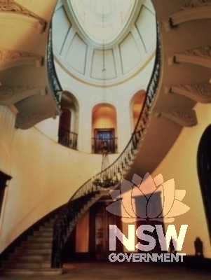 The stairway is Marulan sandstone and built into the wall, resing on the tread underneath. The cast iron bannisters are painted in imitation bronze.