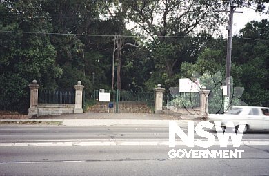original gates and section of palisade fence as seen from Parramatta Road with garden beyond.