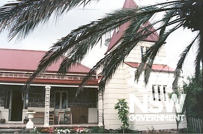 View of Courunga showing two storey Victorian Gothic corner tower of timber construction.