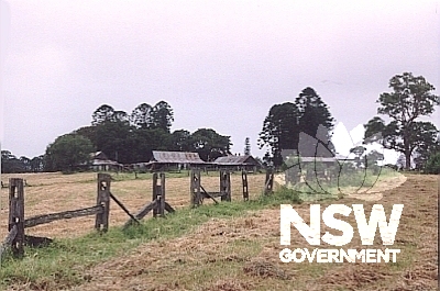 View of farm buildings and fence.  Three generations of the Pearce family owned the farm (direct descendents of Matthew Pearce the first settler in the Parramatta district) and were responsible for the development of the farm.