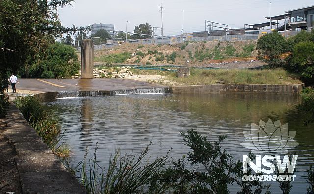 The downstream, curved, northern face of Liverpool  Weir, taken from the modified section at the end of the eastern bank.