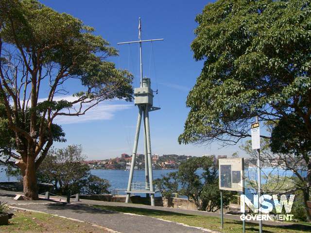HMAS Sydney Memorial Mast showing two of the memorial trees planted in 1964 to HMAS Sydney II and HMAS Perth. The replant memorial tree for HMAS Canberra is out of site to the left of this image.