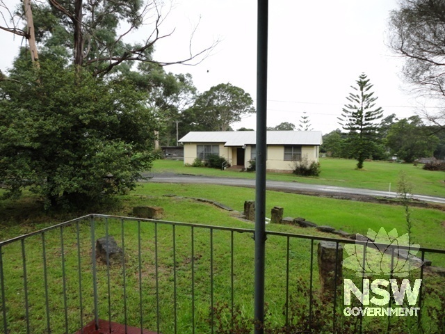 Southern most house viewed from front porch of Matron's Cottage. The existing entry drive from Beinda Street is seen here, the original entry was from Brinawarr Street.