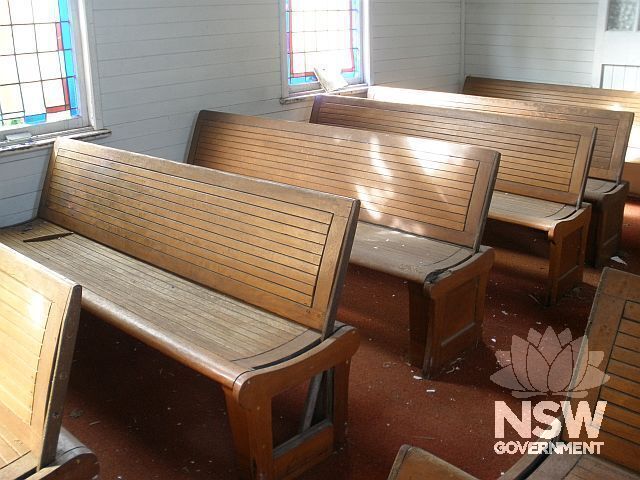 Interior: There are six rows of adjustable timber pews on each side of the central aisle. These are reputedly former tram seats.