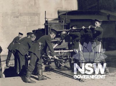 Shand Mason No.1 Manual Fire Engine in operation during a display in the presence of His Excellency the Governor of NSW Sir Dudley De Chair in Castlereagh St, 1926