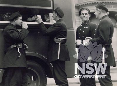 Firemen receiving refreshment from the 1942 21W Mobile Canteen