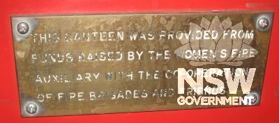 Plaque on left hand side of the body stating: This canteen was provided from funds raised by the Women's Fire Auxiliary with the cooperation of the Fire Brigades and friends
