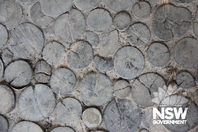 Baronda - spotted gum timber offcut 'tiling' on ground on outside house near entrance (similar to  floor detail found at Penders)