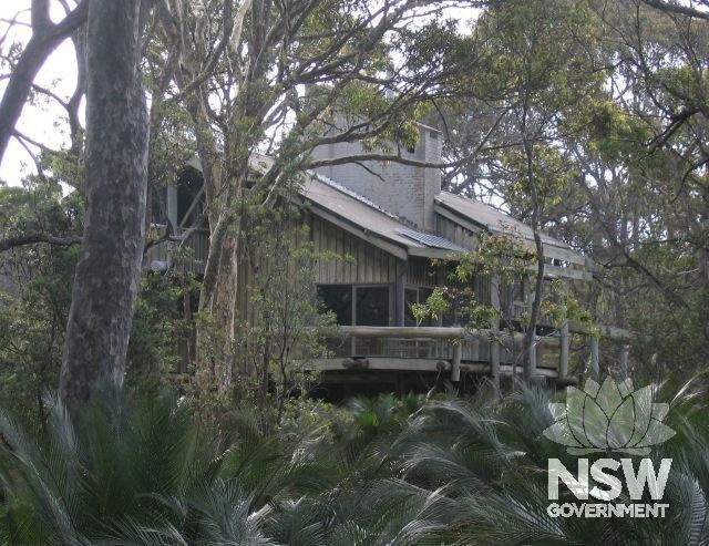 Façade of Baronda holiday house seen through bush