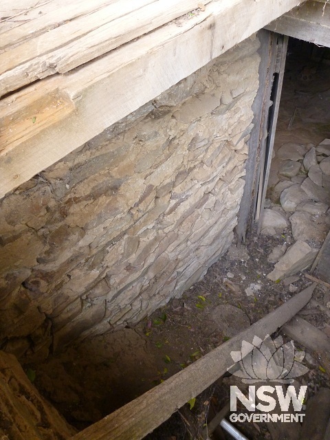 Stone walled cellar under west façade
