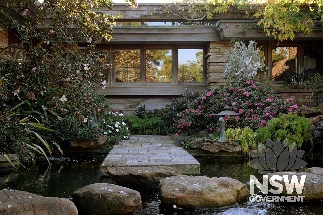 Stepping stones across Koi Pond to front entrance