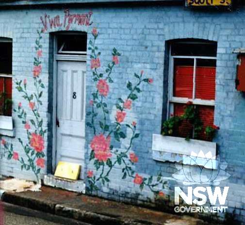 View of painting on one of the Scott Street cottages while occupied by squatters