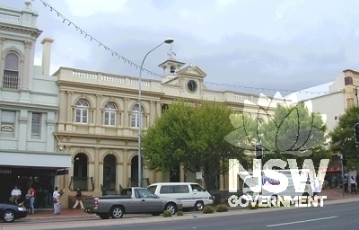 The northern facade of Orange Post Office showing classically styled adjacent buildings.