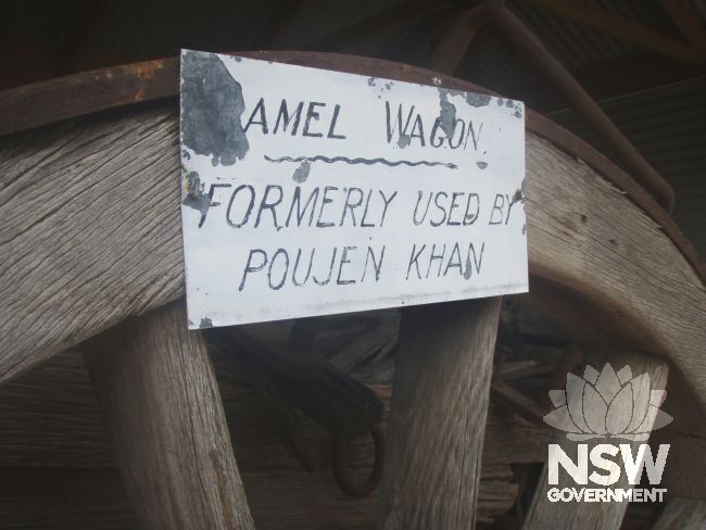 Signage on one of the  wagon wheels detailing the user of the wagon