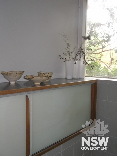 Bathroom detail, note frameless glazing. Ceramics by Sheila Simpson-Lee.