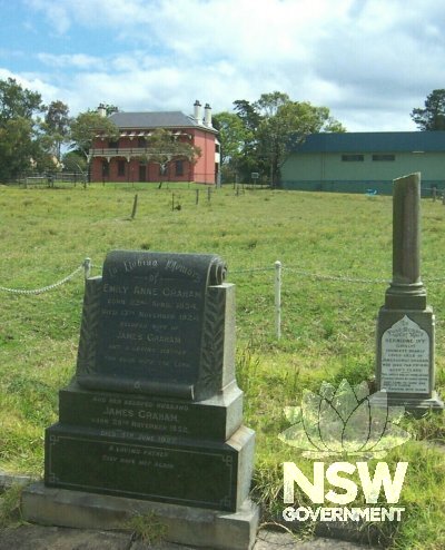 Photo of east façade of Graham Lodge from the family cemetery, with Nowra Tourist Centre at right, 2003