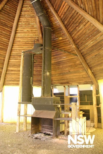 Interior of the Barn, showing fireplace and octagonal roof.
