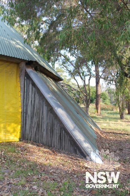 Exterior of the Barn showing one side with timber-enclosed space for bathroom.