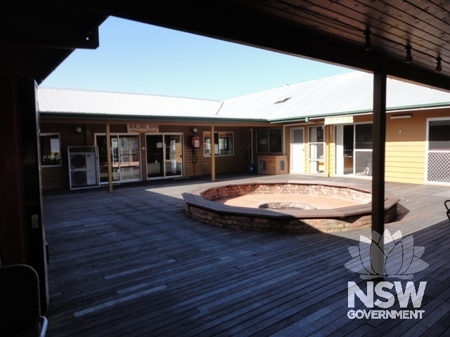 Former courtyard with former big boys dorm in centre and former recreation hall on right.