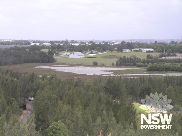 View from Woo-La-Ra. Wetland in foreground. Woodland on top left. Building 22 and parade ground forward centre.
