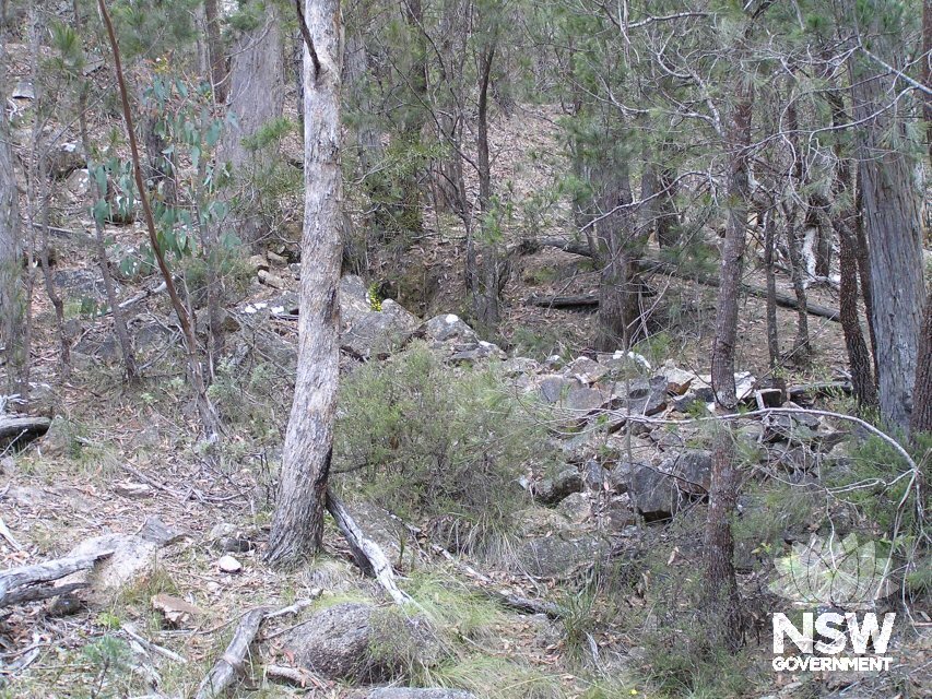 Stone walling and fill removed form underneath roadway