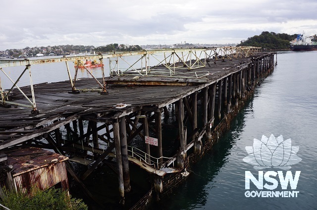 Coal loading distributing wharf and oil pump shed