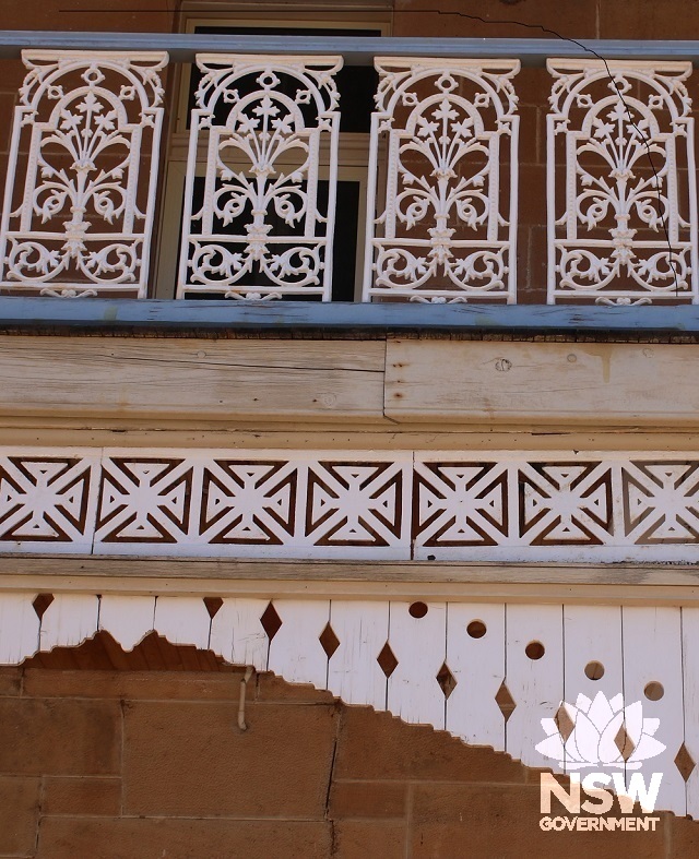 detail of residence verandah fretwork and cast iron lace