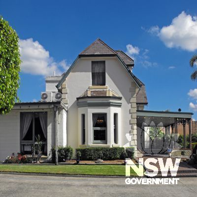 Old Congregational Manse (side elevation).  The recent extensions have had an unsympathetic impact on the current aesthetic qualities of the Manse but are potentially reversible.  The important roof form has survived relatively intact.
