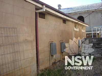 East façade of the 1881 Cell Block Wing, with Hospital Wing in the background