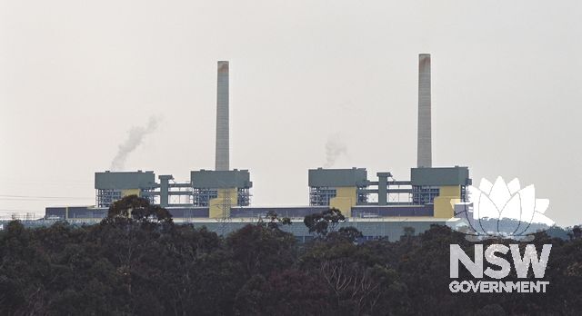 Eraring Power Station, as it appears silhouetted against the sky, viewed from one of its main coal sources, Cooranbong Colliery, to the west of the Power Station. (Doring Neg.409.24) (also see supplementary images)