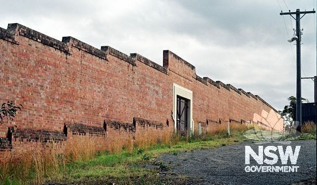The north-west wall of the prison, showing the gateway in the perimeter wall. (Doring Neg.407.31a)