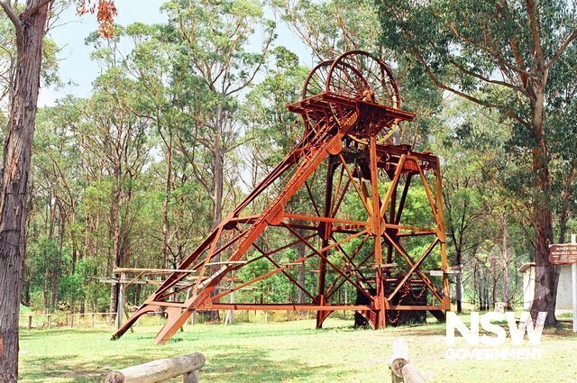 The top half of the West Wallsend steel head-frame, when located at Freeman's Waterholes, (Doring Neg.465.34). The headframe has since been relocated to a site next to the Argenton Mine Rescue Station to form part of a miner's memorial.