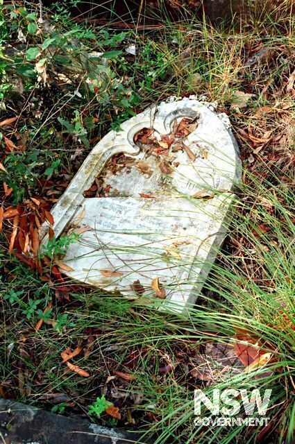 One of many recently smashed headstones in the Cemetery on Billygoat Hill S-W of Booragul Station. This stone is a memorial to Robert Jury, died 1908, & Henry Barrett, died 1915. The long-abandoned cemetery is reverting to bush. (Doring Neg.480.16, 1993)