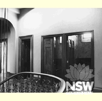 Internal staricase with view of internal bathroom.  It contains elements of high individual and often unique quality, including a domed stairwell and geometric stair of unique quality and design in Australia.