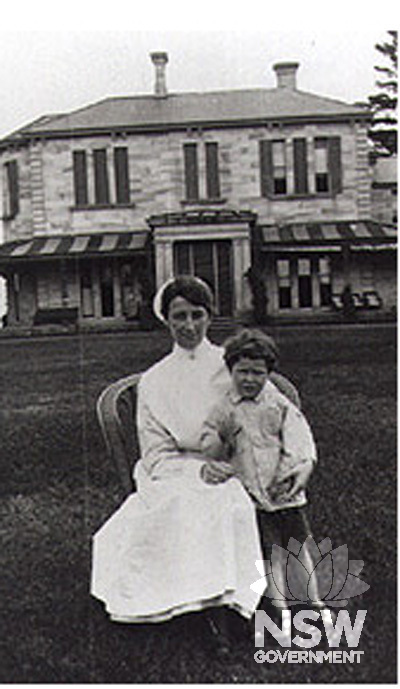 Nurse Gwendolyne Mabel George with her nephew Siddy (Sidney) George outside Denistone House, around 1917. Ryde Library image Ref No. 5482380