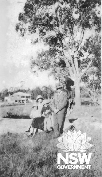 McIlquham family at Oak Flats 1934. The house in  the background is the Queenslander Cottage.