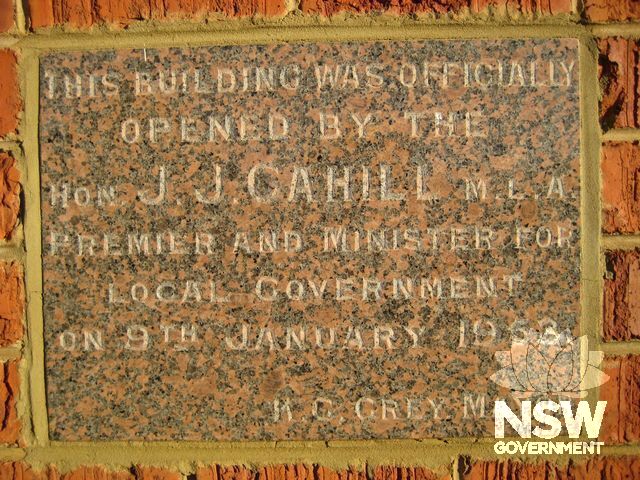 Plauqe commemorating the official opening of the original council chambers.