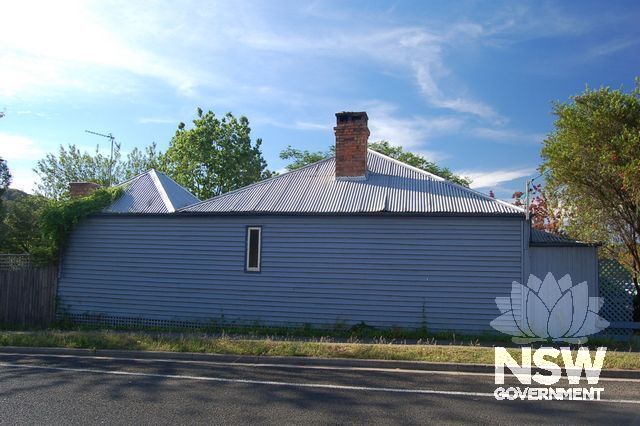Cottage showing the traditional way of extending a roof, that retains the smallness of the cottage bulk (Wall cladding and window a later unsuitable addition).
