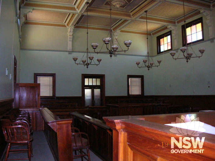 The courtroom of Nyngan Courthouse, showing the original coffered ceiling and timber joinery.