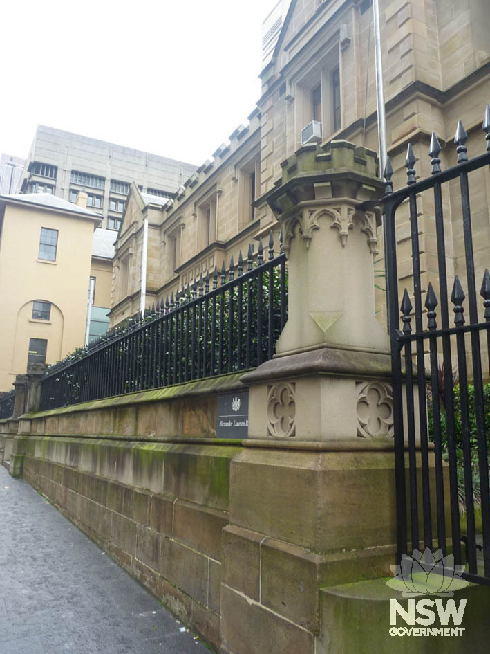 Detail of front sandstone and iron fence along the Elizabeth Street side of the Old Registry Office.