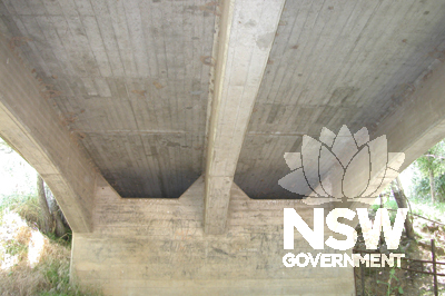 Cemtreline view under northern approach span with three girders, showing approach slab extending beyond abutment wall