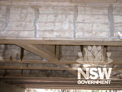 Reinforced conctete main and cross beams of redecking. Note crack repairs