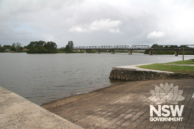 View looking upstream with bridge in background and probable old ferry ramp in foreground